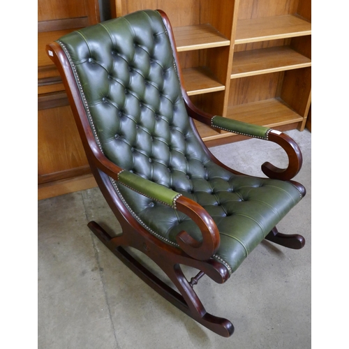 120 - A Regency style mahogany and green leather rocking chair