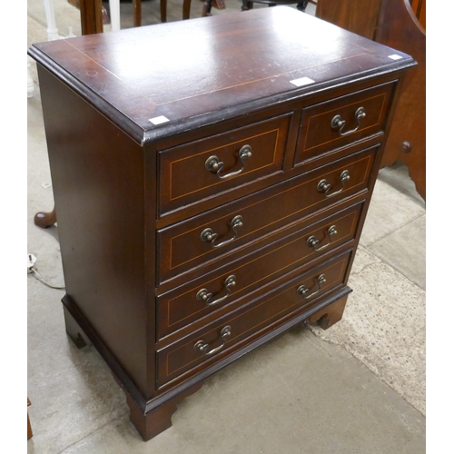 126 - A small George III style inlaid mahogany chest of drawers