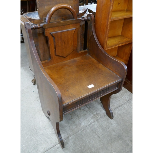 127 - A Victorian Aesthetic Movement walnut hall chair