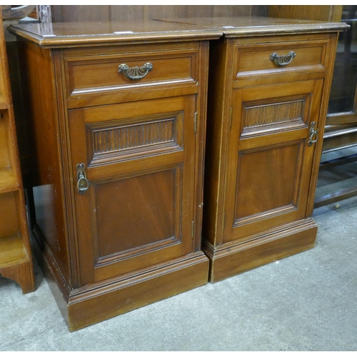 129 - A pair of Victorian walnut pot cupboards