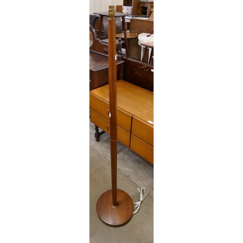 76 - A teak standard lamp