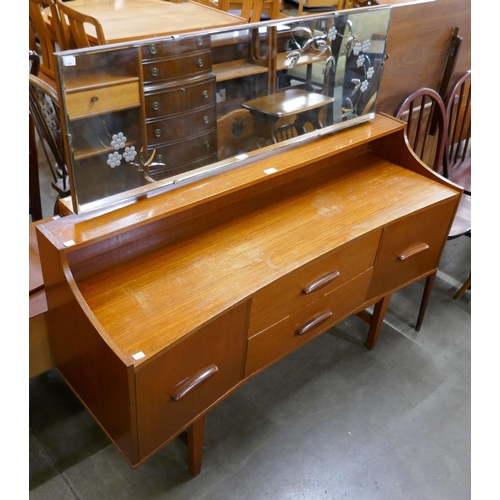 79 - A teak dressing table