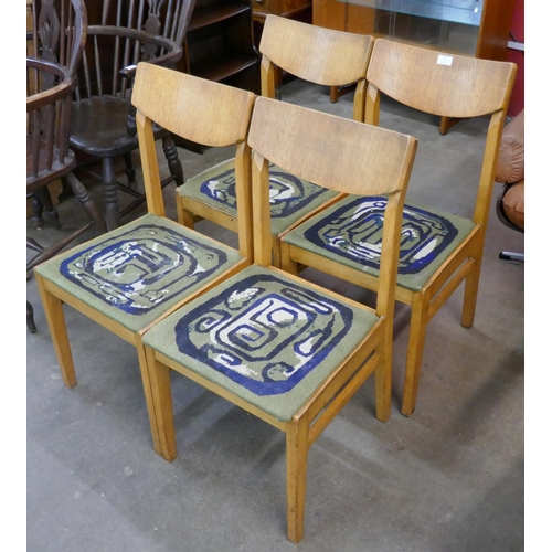 92 - A set of four oak dining chairs