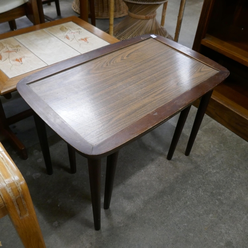 92F - An oak nest of tables, a simulated rosewood nest of tables and two occasional tables