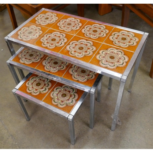 92G - A chrome and tiled top nest of tables