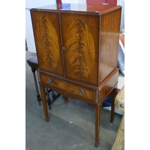 99 - A Queen Anne style mahogany cocktail cabinet