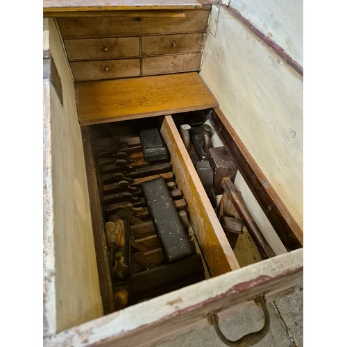 275 - A Victorian fitted pine tool chest, containing tools
