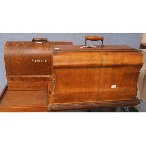 312 - Two cased sewing machines