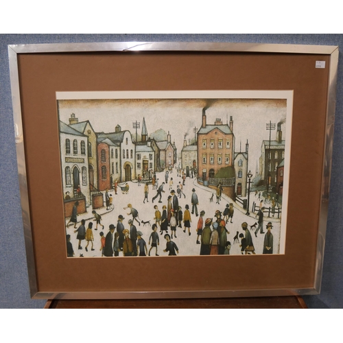 320 - A limited edition L.S. Lowry print, The Old Town Hall, framed two other Lowry prints