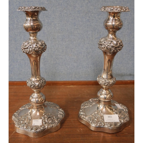 365 - A pair of silver plated candlesticks