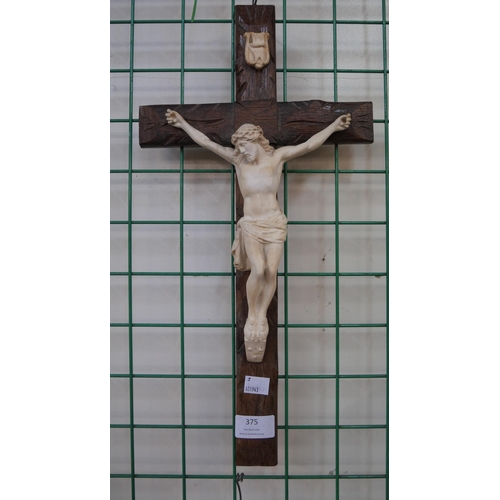 375 - A French wooden and faux ivory crucifix