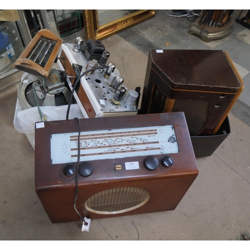 378 - A vintage radio and radio parts, dials, speakers, transformers, etc.