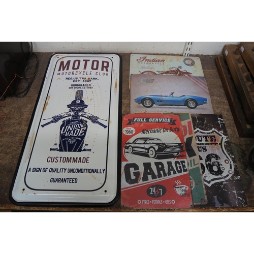 410 - A tin motorcycle sign and five other small signs