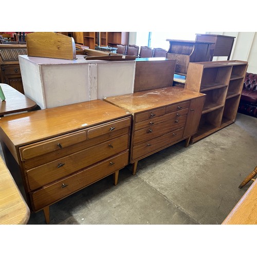 261 - A teak chest of drawers, dressing table, highboard and bookshelves