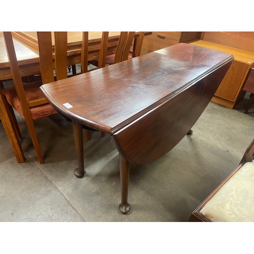 95 - A George II Cuban mahogany drop-leaf pad foot dining table