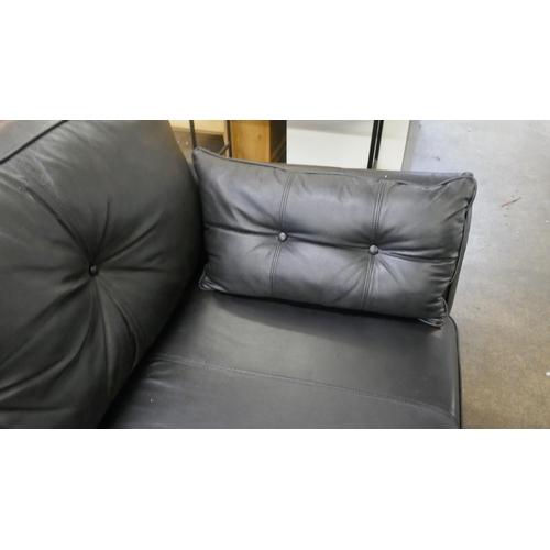 1387 - A black leather three seater sofa