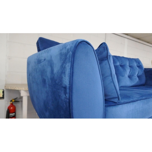 1419 - A blue velvet Hoxton three seater sofa
