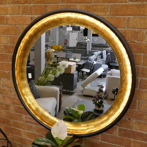 1512 - A large circular wall mounted illuminated USB chargeable mirror