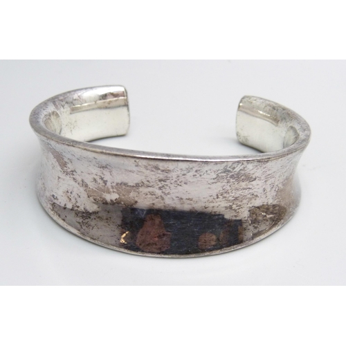 1004 - Four silver bangles, 115g, (one smaller size)