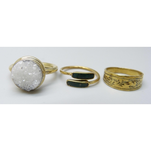 1021 - Three silver gilt rings, K, M and P