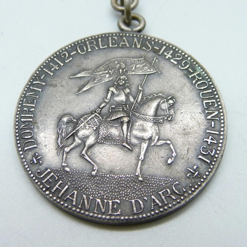 1051 - An Antique Joan of Arc medallion/fob, length 17.5cm