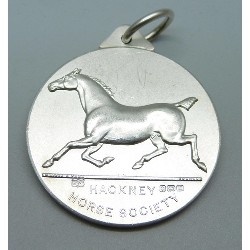 1052 - A silver Hackney Horse Society medal hallmarked Birmingham 1911, Mappin & Webb, 49.5g, 45mm