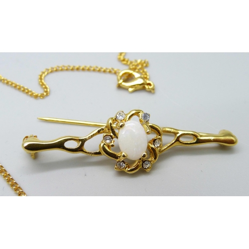 1055 - An opal and crystal set brooch and a matching pendant with chain