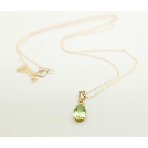 1063 - A 9ct gold and peridot pendant and chain, 0.8g, chain 45cm