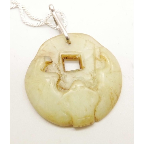 1073 - A jade pendant on a chain