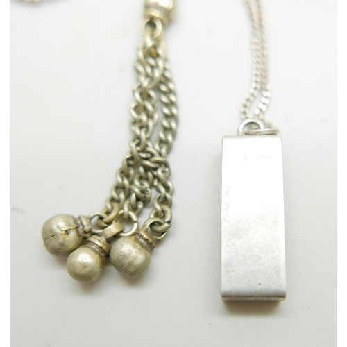 1081 - Two silver chains, a silver domino pendant and one other pendant