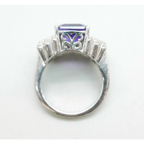 1094 - A silver ring with an amethyst and cubic zirconia set wing detail, size Q, by TJC