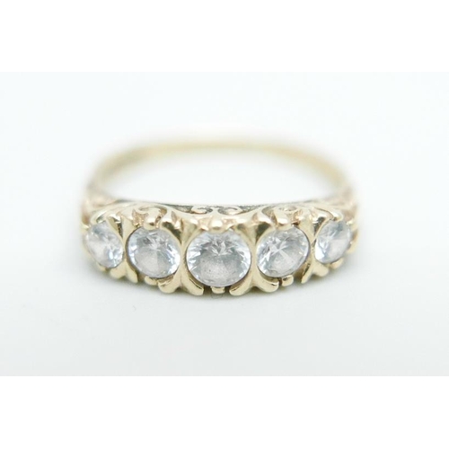 1096 - A 9ct gold ring set with white stones, 2.6g, P