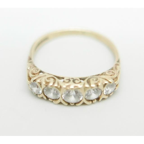 1096 - A 9ct gold ring set with white stones, 2.6g, P