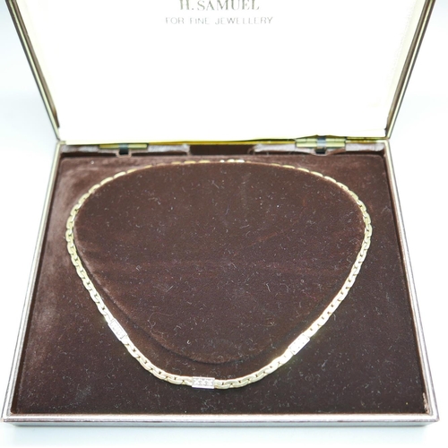 1105 - A 9ct gold and diamond necklace, 16.6g, 39cm