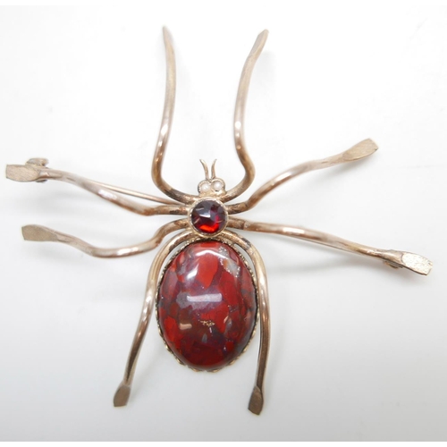 1119 - A large plated silver spider brooch, set with agate, faceted garnet and pearl eyes