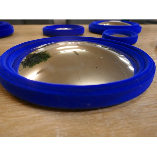 1324 - A set of Six Blue flocked convex mirrors