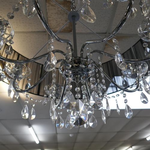 1456 - A chrome eight arm chandelier with black shade