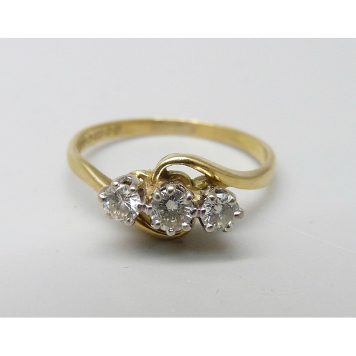 1002 - An 18ct gold and three diamond ring, 2.3g, K