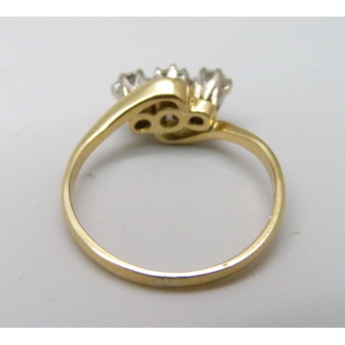 1002 - An 18ct gold and three diamond ring, 2.3g, K