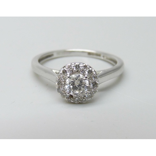 1003 - An 18ct white gold and diamond ring, 0.5ct total diamond weight marked on the shank, 2.7g, M, lackin... 