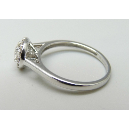 1003 - An 18ct white gold and diamond ring, 0.5ct total diamond weight marked on the shank, 2.7g, M, lackin... 