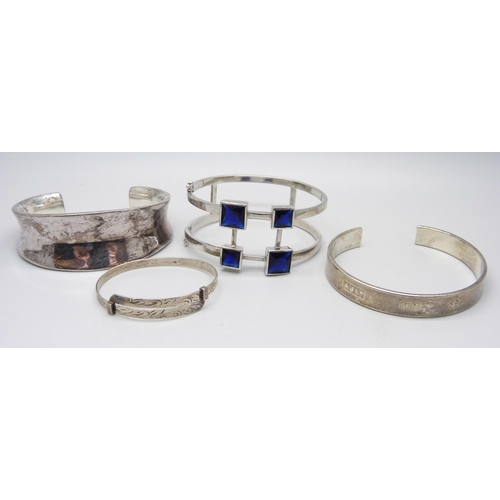 1004 - Four silver bangles, 115g, (one smaller size)