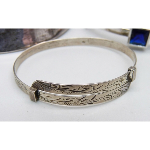 1004 - Four silver bangles, 115g, (one smaller size)