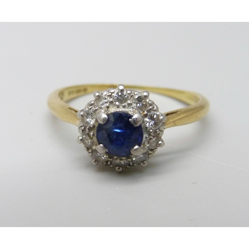 1030 - An 18ct gold and platinum set, diamond and sapphire ring, 3.1g, O, sapphire a/f