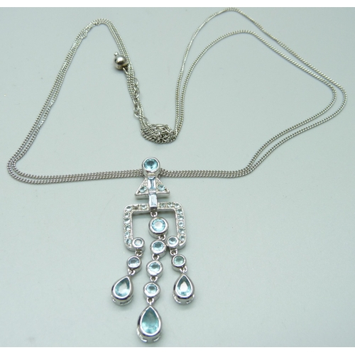 1034 - A modernist silver and gemstone pendant and chain, boxed