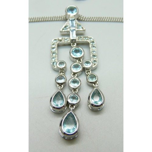 1034 - A modernist silver and gemstone pendant and chain, boxed