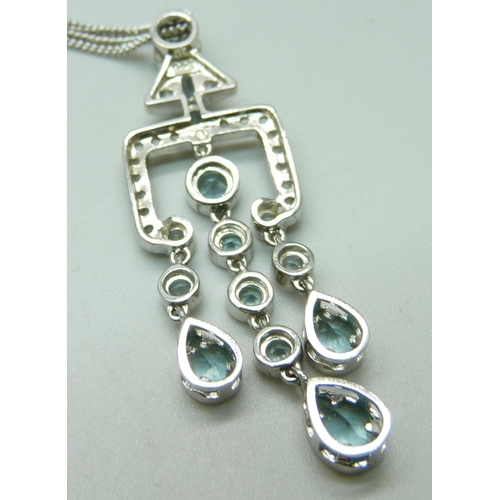 1034 - A modernist silver and gemstone pendant and chain, boxed