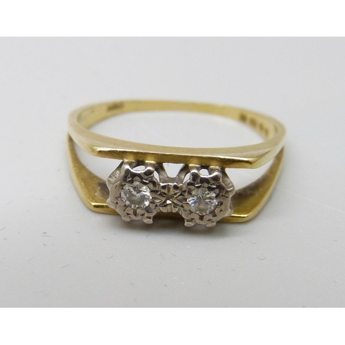 1038 - An 18ct gold and two stone diamond ring, 2.2g, J