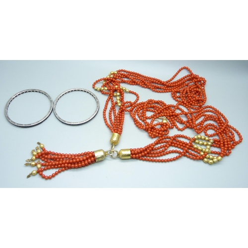 1061 - A vintage silver gilt and faux coral necklace, approximately 107cm, and two white metal and stone se... 