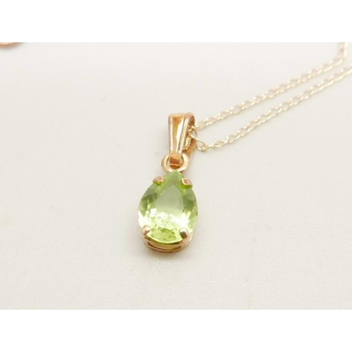 1063 - A 9ct gold and peridot pendant and chain, 0.8g, chain 45cm